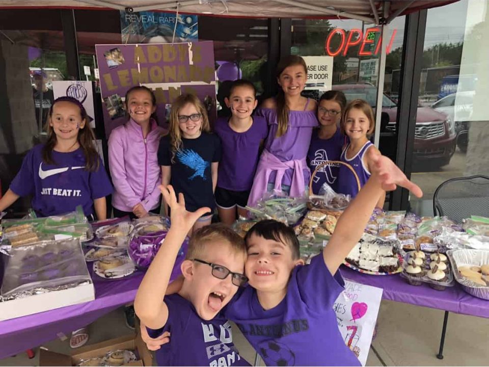 Fundraiser Event volunteers wearing purple